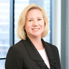 A professional headshot of Cheryl Clarkin in front of windows.