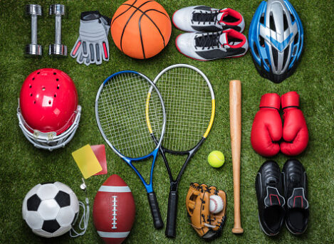 High angle view of various sports equipment on grass.