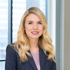 A professional headshot of Siobhan Surette in front of windows.