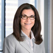 A professional headshot of Susan DeBlasio in front of windows.