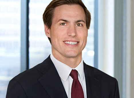 A professional headshot of Stephen Nelson in front of windows.