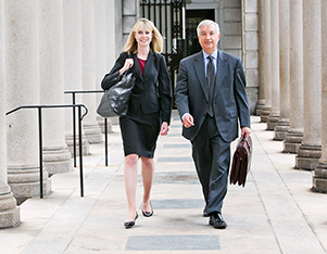 Two attorneys from Adler Pollock & Sheehan representing the State of Rhode Island in a pension case.
