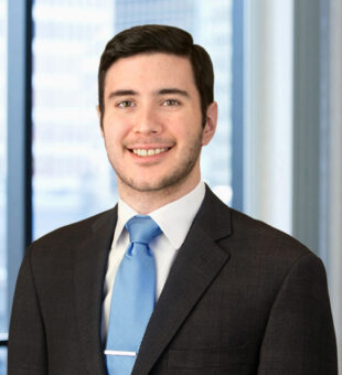 A professional headshot of Michael D'Ippolito III in front of windows.