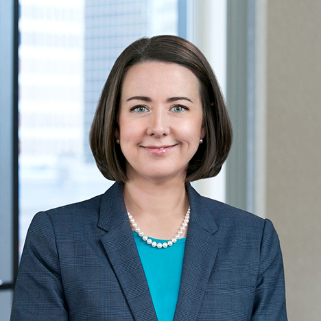 A professional headshot of Kristin Matsko in front of windows.