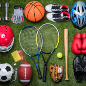 High angle view of various sports equipment on grass.